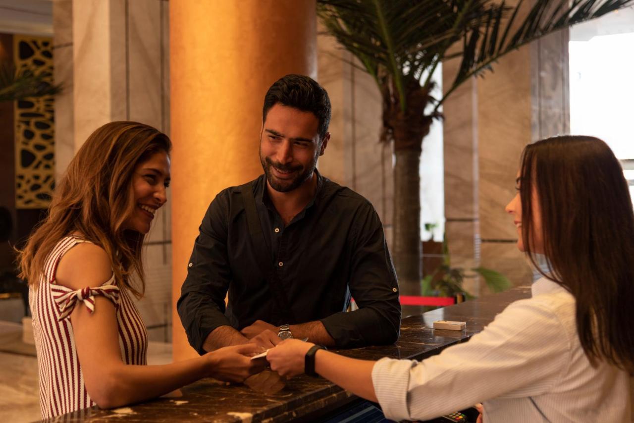 Grand Ocean El Sokhna Hotel Ain Sukhna Exterior photo A hotel manager greeting guests